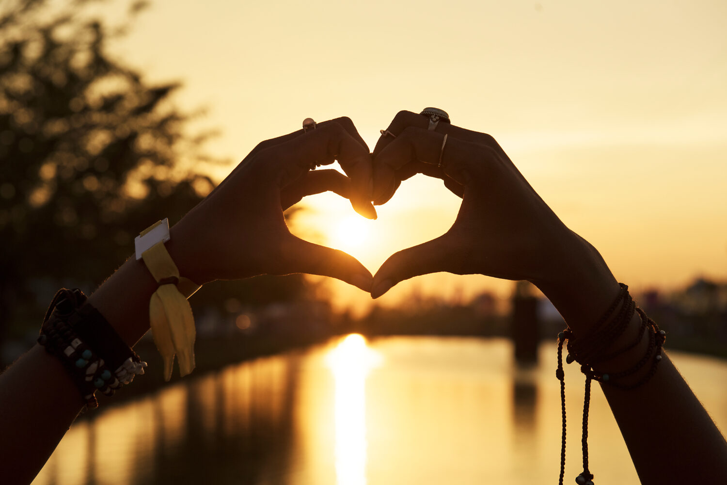 People Making Hands in Heart Shape Silhouette Sunset